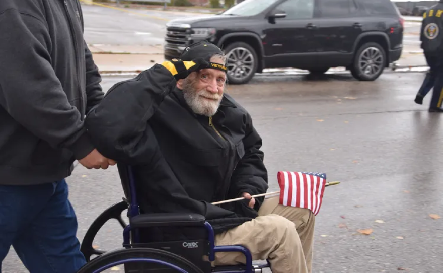 A disabled veteran participates in the annual Detroit Veterans Day Parade, reflecting community tribute and remembrance.